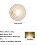 MECOLA Round Resin Accent Wall Sconce Small Glass Globe Shade Wall Lamp showing concentric design, 22cm size, ideal for hallways.