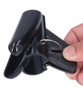 Flexible Black Spiral Cable Wrap For Cord Management 20mm Plastic Wire Sleeve, black cord clip being held.