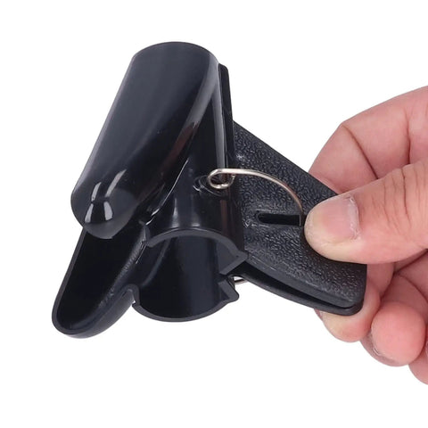 Flexible Black Spiral Cable Wrap For Cord Management 20mm Plastic Wire Sleeve, black cord clip being held.