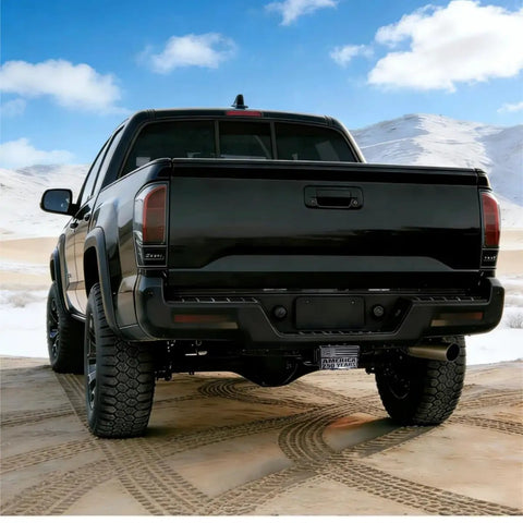 Black truck with Limited Edition American Flag Trailer Hitch Cover Honoring 250 Years Of Freedom in desert landscape.