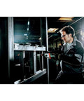 Man using Beast 1300W Hammer Drill With Impulse Mode For Damaged Screw Removal And Spot Drilling in workshop setting