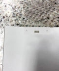 Close-up of a white metal vertical blind repair tab, showing a clip for attaching to blinds, from the 10 Pc Vertical Blind Repair Tabs Heavy Duty Metal Vane Savers Universal Fit Stop The Madness Of Broken Blinds Rust Proof Fixer For Dog Nips Wind Damage Sturdy.