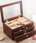 Wooden jewelry box with open drawers on table, showing compartments with visible 1 inch brass butt hinges.