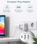 2 Pack 6 In 1 European Power Plug Adapter converts Type C sockets to 3 US outlets, 2 USB A ports, 1 USB C port, shown in use