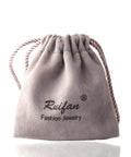 Grey jewelry pouch with Ruifan logo, cord drawstrings, used for storing Gold 20G Curved Nose Stud Ring With 2mm Ball.
