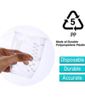 Hand holding one of the 100 Pack 8oz Graduated Clear Plastic Measuring Cups With Wooden Stirring Sticks For Mixing Paints Pigments Epoxy Resins And Other Materials A Durable Reusable DIY Kit For Precise Easy Read Measurements, showing durable polypropylene labeled as disposable, durable, accurate.