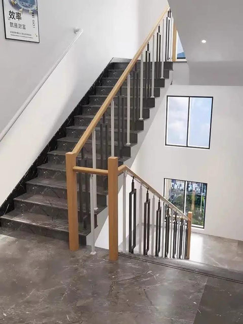 Eight Piece Metal Baluster Kit For Outdoor Deck And Porch Railing featuring modern black balusters on a staircase.