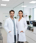 Two individuals wearing Unisex Button Front Lab Coat With Roomy Fit That Fits Over Clothes, white, in a clinic setting