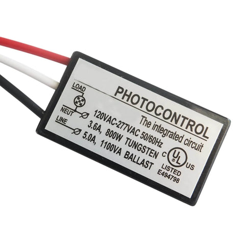 Close-up of Outdoor Dusk To Dawn Photoelectric Switch 120V To 277VAC 5 Amp UL Listed, showing wiring details and label information.