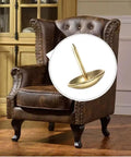 Hella Sturdy Gold Upholstery Tacks 100 Pack Set For Furniture Nailhead Decorative Trim straight up close view on armchair.