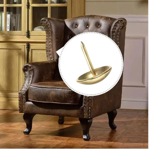 Hella Sturdy Gold Upholstery Tacks 100 Pack Set For Furniture Nailhead Decorative Trim straight up close view on armchair.