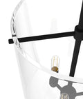 Close-up of Sacha Pendant Light in natural iron finish with clear glass shade, showcasing durable steel build and modern design.