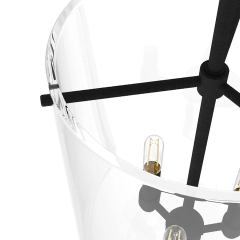 Close-up of Sacha Pendant Light in natural iron finish with clear glass shade, showcasing durable steel build and modern design.