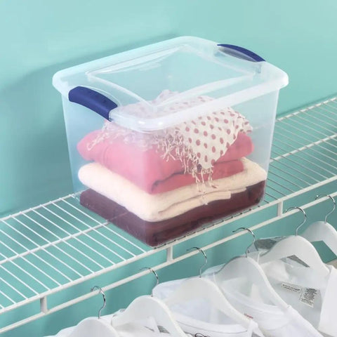 Heavy-Duty Clear Plastic Storage Bins With No-Fuss Blue Latches, 27 Qt Stackable Organizers For Wardrobe Clothes And Bulk Supplies, Bpa Free And Built Tough To Handle Heavy Lifting, 2 Pack with folded clothes on a shelf.