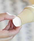 Hand applying Furniture Glides For Legs And Feet With Plastic And Iron Nails Oval Or Round Shape No Scratch Floor Protection