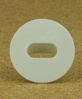 White round Skywalker dual feed-through cable bushing with oval center opening, front view.