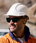 Man wearing Heavy Duty Full Frame Shield Safety Glasses With Kickass Polarized Cobalt Mirror Lenses for outdoor work.