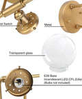 Close-up details of Three Light Vintage Industrial Bathroom Vanity Wall Sconce With Handblown Clear Glass Globes And Antique Gold Finish