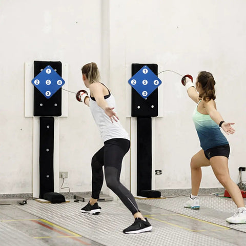 Two women practicing fencing on Five Target Fencing Practice Pad For Foil And Epee Wall Mounted Striking Target Gear.