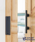 Close-up of wooden door with black pull handle from 5 Foot Top Mount Sliding Barn Door Hardware Kit With Pull Handle And Floor Guide Fits 30 Inch Wide Door Panel T Shape Hanger DIY Friendly Easy To Install Premium Quality.