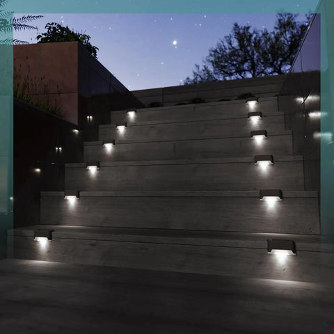 Heavy Duty Solar Deck Lights Outdoor 16 Pack Waterproof LED Step Lights For Stairs Fence Steps And Patio Railings, illuminating staircase at night.