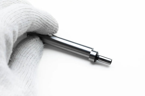 Close-up of Industrial Grade Mechanical Edge Finder Featuring .200-Inch Tactile Contact Tip and 3/8-Inch Shank held in a gloved hand.