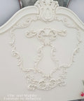 Ornate headboard painted with Chalk Mineral Furniture Paint In Drop Cloth, 32oz, Matte Linen White Finish For DIY Projects