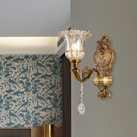 Matte Brass Vintage Wall Mount Lamp With Beveled Crystal Shade, Antique Floral Sconce Light With Retro Vibes on gray wall
