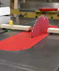 Bulletproof Zero Play Miter Stop Fence With Quick T Track Lock for precise cuts on table saw with red insert and wooden clamps.