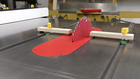 Bulletproof Zero Play Miter Stop Fence With Quick T Track Lock for precise cuts on table saw with red insert and wooden clamps.