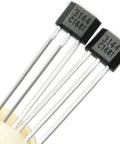 Close-up of two TO92 linear Hall effect sensors, model 3144, used for EV motor repair and electronics fix.