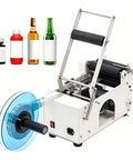 No Fuss Semi Automatic Round Bottle Labeler With Ergonomic Push Lever shown with various bottles, designed for small business teams.