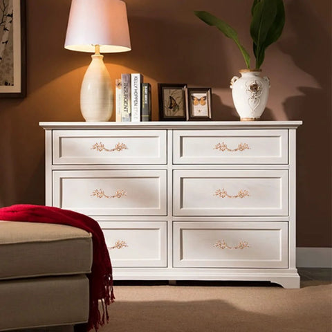 White dresser in a farmhouse-style room featuring Antique Rose Gold Zinc Alloy Cabinet Pulls Set Of 10 For Farmhouse Kitchens And Vintage Dressers.