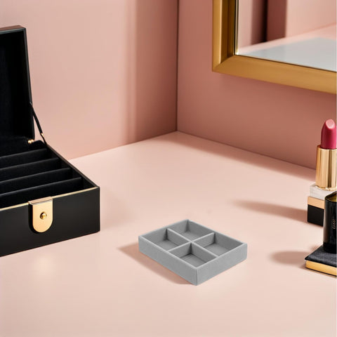 Premium Solid Go-To Velvet Jewelry Tray, Four Secure Grid Dividers on a stylish vanity table.