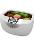 Heavy Duty 2.5L Ultrasonic Cleaner With Smart Digital Timer And Heating Element Ultra Quiet Jewelry Watch Veggie Scrubber Includes Stainless Steel Basket filled with fruits and vegetables.