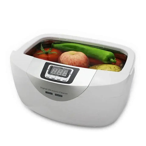 Heavy Duty 2.5L Ultrasonic Cleaner With Smart Digital Timer And Heating Element Ultra Quiet Jewelry Watch Veggie Scrubber Includes Stainless Steel Basket filled with fruits and vegetables.