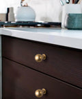 Installed Six Pack Zinc Alloy Drawer Knobs 0.94 Inch Diameter Champagne Bronze Cabinet Knobs In Modern Style on dark cabinet drawers