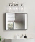 Killer 3 Light Wall Sconces With Clear Glass Shade And Brushed Nickel Finish above a modern bathroom mirror, illuminating the space.