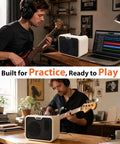 Musician using Compact 10W Bass Amp For Practice, Dual Channel Normal And Drive, Battery Powered Portable Bass Guitar Amp at home