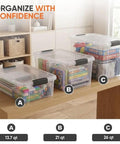 Clear Plastic Storage Bins With Snap On Lids For Home Office Organization Stackable Crates BPA Free Non Toxic Craft And Tool Organizer 13.7 Quart, 21 Quart, 26 Quart on a wooden table.