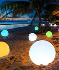Beach scene illuminated by Cordless 16 Inch LED Glowing Ball Light With Remote RGB Color Changing Waterproof Glow Ball.