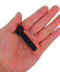 Hand holding a nylon puller head from Explosion-Proof Zipper Pull Replacement Kit For Luggage And Suitcases, 10-Pack.