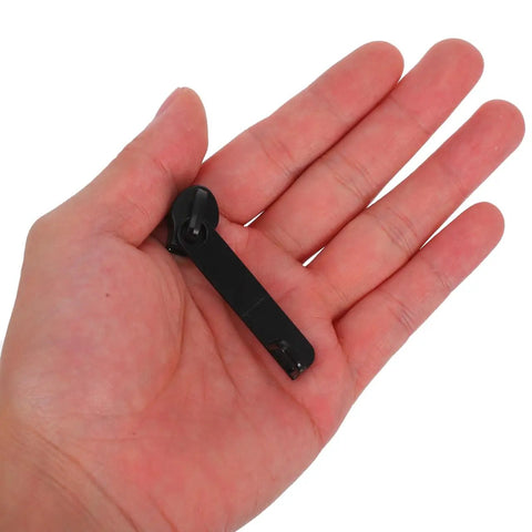 Hand holding a nylon puller head from Explosion-Proof Zipper Pull Replacement Kit For Luggage And Suitcases, 10-Pack.