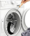 Set Of 2 Dryer Vent Cleaner Tools With 4.5 Inch Handle, 27 Inch Flexible Stainless Steel Shaft And 22.5 Inch Bristles, Quick Lint Remover For Dryers, Fridge Coils, AC Units, And Hard To Reach Spots in front of a front-load washer