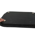 Hand placing Self Adhesive Felt Furniture Pads 3/4 Inch Beige 120 Pack on a black textured surface.