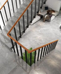 Tough As Nails Side Mount Banister Posts Black Metal Deck Railing Spindles with heavy duty adjustable brackets on stairs.