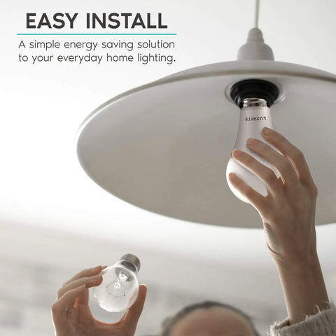 Person installing Bright A21 LED Bulbs 150 Watt Equivalent Pack, 2550 Lumens, 4000K Cool White into light fixture indoors