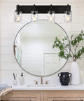 Four Light Modern Farmhouse Vanity Light With Clear Hammered Glass Shades In Black Finish over bathroom mirror and decor