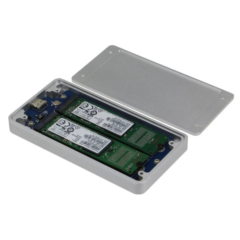 Dual M2 NGFF Raid Enclosure For Sata Iii Drives Featuring Usb Three Point One Type C Port And Ten Gbps Lightning Fast Transfer Speeds With Seamless Plug And Play Setup Inside Compact Metal Frame For Hotswapping Favorites Zero Hassle Guaranteed, silver aluminum casing with two SATA drives inside.
