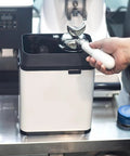 Kick Up Your Daily Brew Routine With This Badass 150 Watt Electric Portafilter Cleaner And Espresso Knock Box Combo For Effortless Home Barista Cleanup, showing portafilter in knock box.